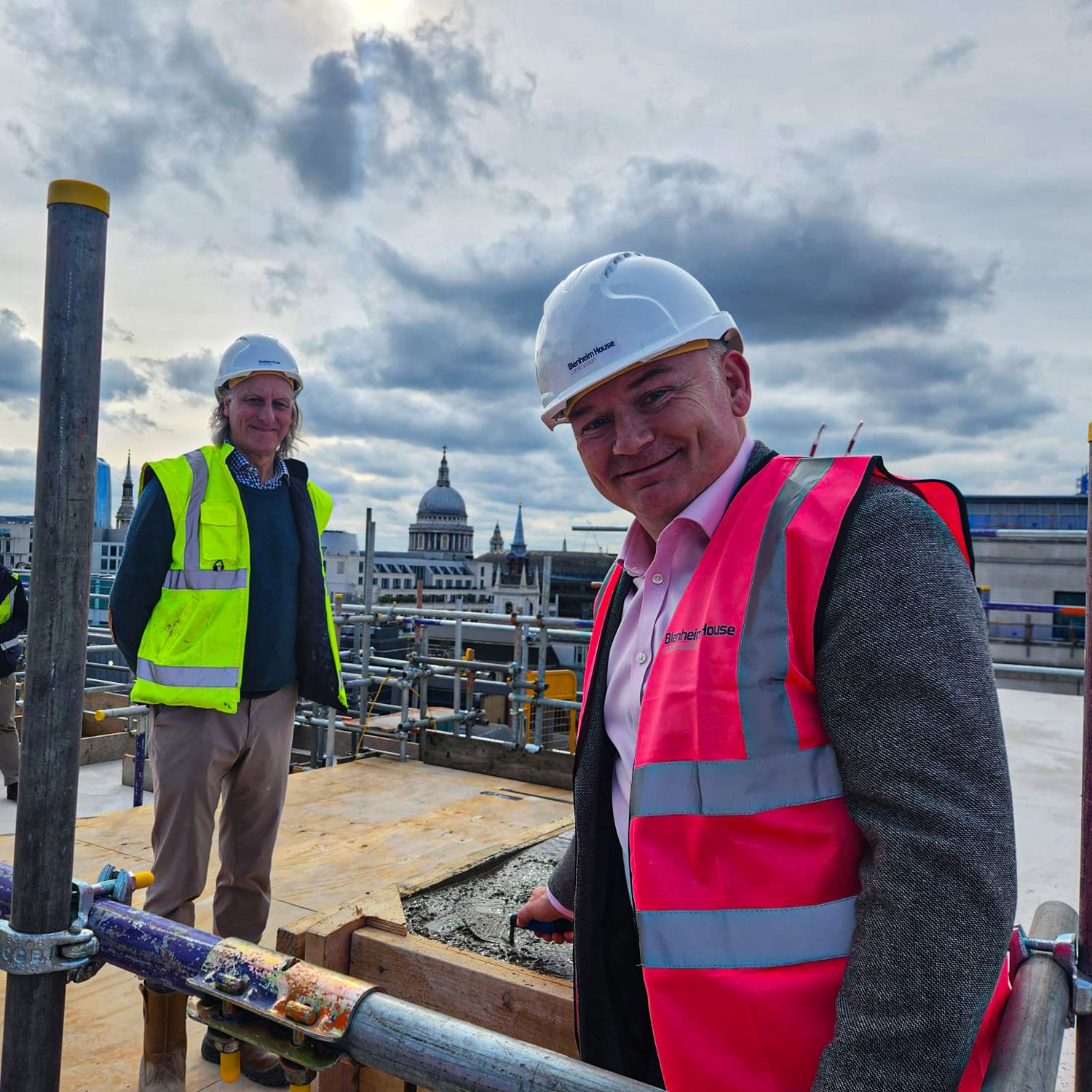 men happy as they top out building